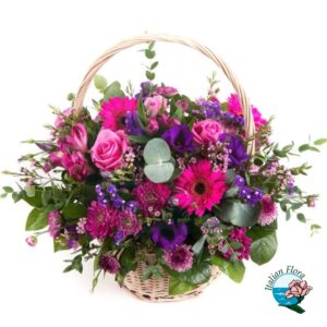 Cesto floreale per funerale con tonalità di fiori rosa e viola
